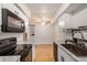 Bright kitchen boasts white cabinets, granite countertops and modern appliances at 2625 E Indian School Rd # 143, Phoenix, AZ 85016