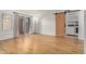 Open-concept living area with sliding glass doors to a patio, plus a barn door to the laundry room at 2625 E Indian School Rd # 143, Phoenix, AZ 85016