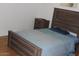Cozy bedroom featuring a wood-look headboard and a wood nightstand at 303 S Recker Rd # 78, Mesa, AZ 85206