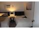 Comfortable bedroom showing twin beds, a side table with lamp, and light and airy decor at 303 S Recker Rd # 78, Mesa, AZ 85206
