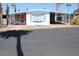 Charming mobile home featuring a carport and a delightful window with light blue trim at 303 S Recker Rd # 78, Mesa, AZ 85206