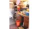 Functional garage featuring workbench area and storage shelves at 303 S Recker Rd # 78, Mesa, AZ 85206