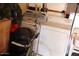 Practical laundry area with a washing machine, dryer, and overhead storage shelves at 303 S Recker Rd # 78, Mesa, AZ 85206
