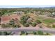Aerial view of multiple gardens, with rows of crops, pathways and perimeter fencing at 3037 E Hobart St, Gilbert, AZ 85296
