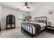 Cozy bedroom with a wrought iron bed frame, natural light, and minimalist decor at 3037 E Hobart St, Gilbert, AZ 85296