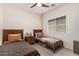 Cozy bedroom with two twin beds, a nightstand, and a window providing natural light at 3037 E Hobart St, Gilbert, AZ 85296
