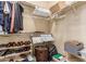 Walk-in closet with organized storage, including shelves and hanging racks for clothing and accessories at 3037 E Hobart St, Gilbert, AZ 85296