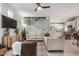 Bright living room features neutral colors, ceiling fan, and tile flooring at 3037 E Hobart St, Gilbert, AZ 85296