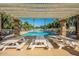 Enjoy a refreshing swim in this inviting pool with shaded pergola and picnic tables for relaxing at 3037 E Hobart St, Gilbert, AZ 85296