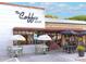 Charming coffee shop with outdoor seating and Perrier umbrellas at 3037 E Hobart St, Gilbert, AZ 85296