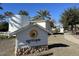 Agritopia community sign with water tower and buildings in the background, under a clear blue sky at 3037 E Hobart St, Gilbert, AZ 85296