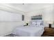 Serene bedroom featuring a striped bed, stylish lamps, and a contemporary piece of art on a light wall at 310 W Earll Dr # 102, Phoenix, AZ 85013