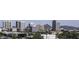 Rooftop view of a city skyline featuring multiple modern office buildings and distant mountain views at 310 W Earll Dr # 102, Phoenix, AZ 85013