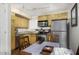 Well-equipped kitchen with stainless steel appliances and ample counter space at 310 W Earll Dr # 102, Phoenix, AZ 85013