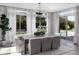 Bright dining room with backyard views, stylish table with seating for six, and modern lighting fixture at 3133 E Silo Dr, Gilbert, AZ 85296