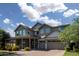 Beautiful two-story home boasts a three-car garage, covered front porch, and well-maintained landscape at 3133 E Silo Dr, Gilbert, AZ 85296