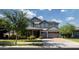 Charming two-story home showcasing a three-car garage and a beautifully landscaped front yard at 3133 E Silo Dr, Gilbert, AZ 85296