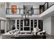 Bright open-concept living room features high ceilings, fireplace, and modern decor and leads to 2nd story loft at 3133 E Silo Dr, Gilbert, AZ 85296