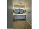Bright bathroom featuring dual sinks, modern lighting, and neutral tones for a clean, contemporary style at 3375 W Verde River Rd, San Tan Valley, AZ 85144