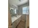 Well-lit bathroom showcasing a vanity with modern fixtures, complemented by neutral walls at 3375 W Verde River Rd, San Tan Valley, AZ 85144