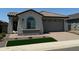 Charming single-story home with a tile roof, manicured lawn, and a brick-paved driveway leading to a two-car garage at 3375 W Verde River Rd, San Tan Valley, AZ 85144