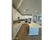 Modern kitchen featuring white cabinets, an island with a sink, and stainless steel appliances for a stylish cooking space at 3375 W Verde River Rd, San Tan Valley, AZ 85144