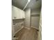 Efficient laundry room with upper cabinets and ample space for storage at 3375 W Verde River Rd, San Tan Valley, AZ 85144