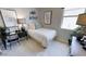 Charming bedroom with a cozy bed, decorative accents, and a desk, creating a comfortable and inviting space at 35068 N Sacramento Wash Rd, San Tan Valley, AZ 85144