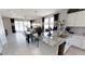 Gourmet kitchen with granite countertops, stainless steel appliances, and an adjacent dining space at 35068 N Sacramento Wash Rd, San Tan Valley, AZ 85144