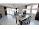 Open-concept living space with dining area, tile floors, and large windows for natural light at 35068 N Sacramento Wash Rd, San Tan Valley, AZ 85144