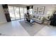Inviting living room with a comfortable sofa, modern decor, and sliding glass doors leading to the backyard at 35068 N Sacramento Wash Rd, San Tan Valley, AZ 85144