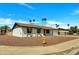 Inviting one-story home with low maintenance desert landscaping and a charming yellow fire hydrant at 3614 W Danbury Dr, Glendale, AZ 85308