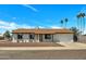 Charming single-story home featuring a well-manicured yard and attached two car garage at 3614 W Danbury Dr, Glendale, AZ 85308