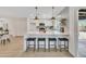Modern kitchen with new white cabinets, stainless steel appliances, and an adjacent dining area at 3614 W Danbury Dr, Glendale, AZ 85308