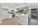 Bright and modern kitchen featuring white cabinets, stainless steel appliances, and a stylish island at 3614 W Danbury Dr, Glendale, AZ 85308