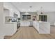 Modern kitchen featuring stainless steel appliances, white cabinets, and an island with marble countertops at 3614 W Danbury Dr, Glendale, AZ 85308