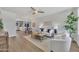 Bright living room with neutral décor, flowing seamlessly into an eat in kitchen at 3614 W Danbury Dr, Glendale, AZ 85308