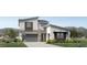Modern two-story home with a gray garage door and stone accents at 3672 W Horse Trail Way, San Tan Valley, AZ 85144