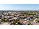 A well-maintained home featuring desert landscaping, mature trees and lawns, and city views at 3713 W Nancy Ln, Phoenix, AZ 85041