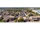 A well-maintained home featuring desert landscaping, mature trees and lawns, and city views at 3713 W Nancy Ln, Phoenix, AZ 85041
