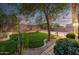 Backyard featuring artificial grass and mature landscaping at 3713 W Nancy Ln, Phoenix, AZ 85041