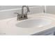 Close-up of a white sink and chrome faucet with a curved spout in the bathroom at 3713 W Nancy Ln, Phoenix, AZ 85041