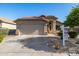Single-story home with tile roof, two-car garage, and desert landscaping for sale at 3713 W Nancy Ln, Phoenix, AZ 85041