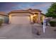 Charming single-story home featuring a tile roof, arched entryway, and a two-car garage at 3713 W Nancy Ln, Phoenix, AZ 85041