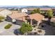 A well-maintained home featuring a desert landscaped front yard and a two car garage at 3713 W Nancy Ln, Phoenix, AZ 85041