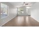 A bright and airy living room features tile floors, neutral paint, and large windows at 3713 W Nancy Ln, Phoenix, AZ 85041