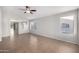A bright and airy living room features large windows, tile floors, and neutral paint at 3713 W Nancy Ln, Phoenix, AZ 85041
