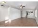 A spacious living room features tile floors, neutral paint, and an open layout at 3713 W Nancy Ln, Phoenix, AZ 85041