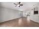 A spacious living room boasts tile floors, an open layout, and bright lighting fixtures at 3713 W Nancy Ln, Phoenix, AZ 85041