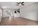 Open living room features tile floors, kitchen bar, and view into adjoined living spaces at 3713 W Nancy Ln, Phoenix, AZ 85041